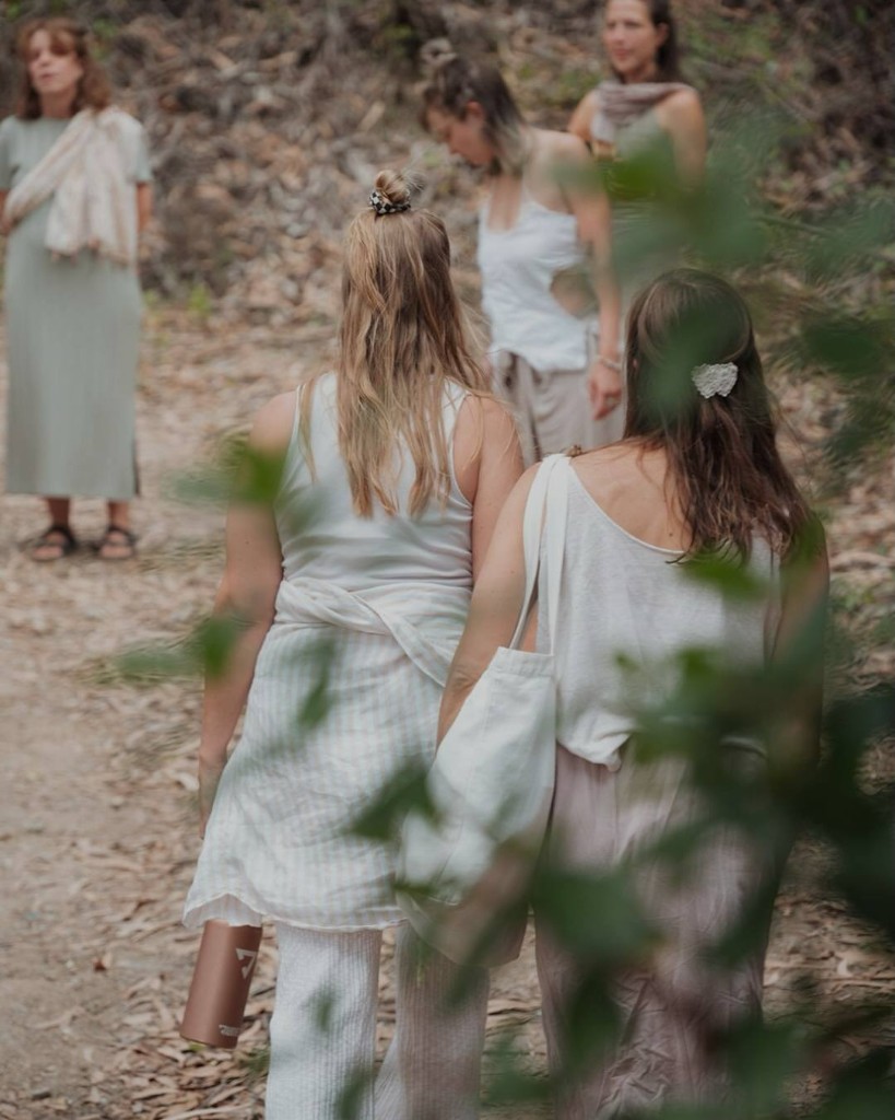 Women walking together along a forest path in Portugal